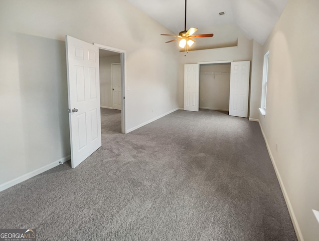 unfurnished bedroom featuring high vaulted ceiling, carpet flooring, a ceiling fan, baseboards, and a closet