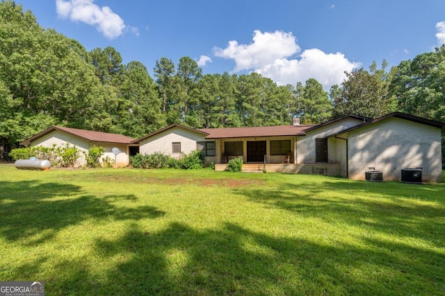 882A Gaissert Church Rd, Sparta, GA 31087 - back of house with a yard and central AC unit