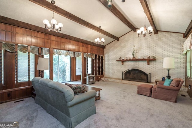 living room featuring vaulted ceiling with beams, carpet, a notable chandelier, and brick wall