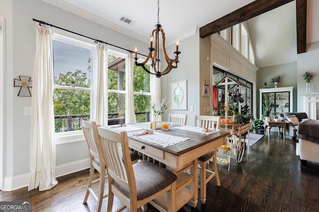 dining space with vaulted ceiling, plenty of natural light, dark hardwood / wood-style floors, and an inviting chandelier