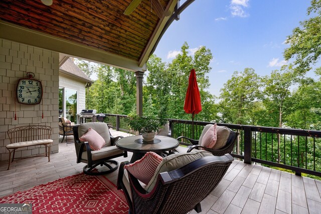 view of patio / terrace with ceiling fan and a grill