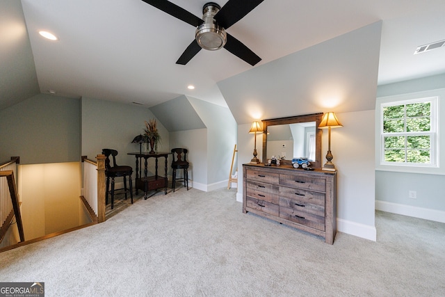 sitting room with ceiling fan, light carpet, and lofted ceiling