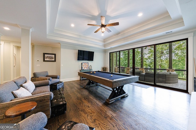 game room featuring dark hardwood / wood-style flooring, billiards, ornamental molding, a raised ceiling, and ceiling fan