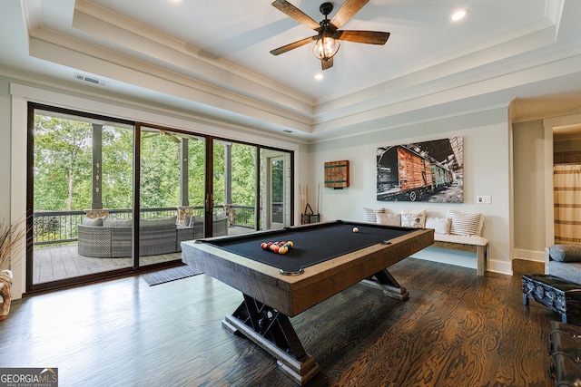 game room featuring dark wood-type flooring, a tray ceiling, ornamental molding, and pool table