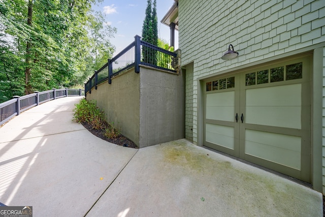 view of side of property with a garage