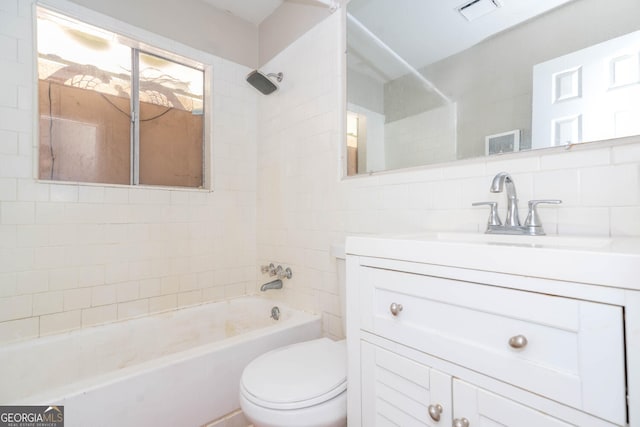 bathroom featuring toilet, shower / bath combination, vanity, visible vents, and tasteful backsplash