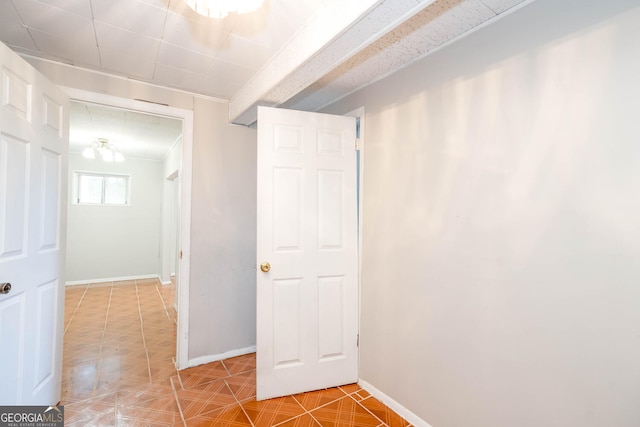 interior space with tile patterned flooring and baseboards