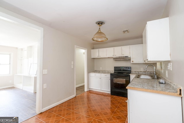 kitchen with pendant lighting, light countertops, white cabinetry, a sink, and black range with electric cooktop