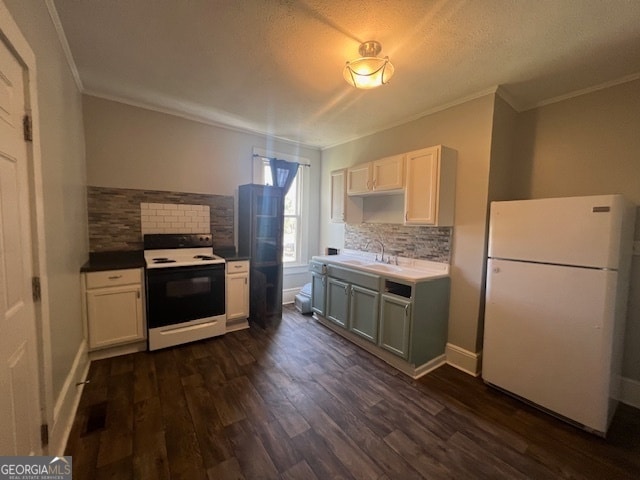 kitchen featuring dark wood-type flooring, tasteful backsplash, white cabinetry, sink, and white appliances