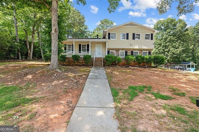 split level home featuring covered porch