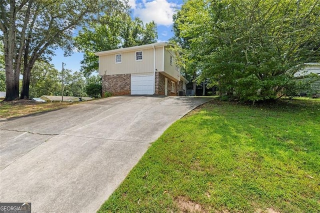 view of home's exterior featuring stone siding, a lawn, an attached garage, and concrete driveway