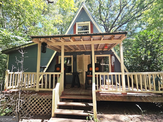 rear view of house with a deck