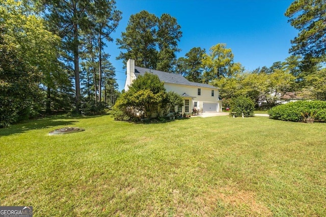 view of yard featuring an attached garage