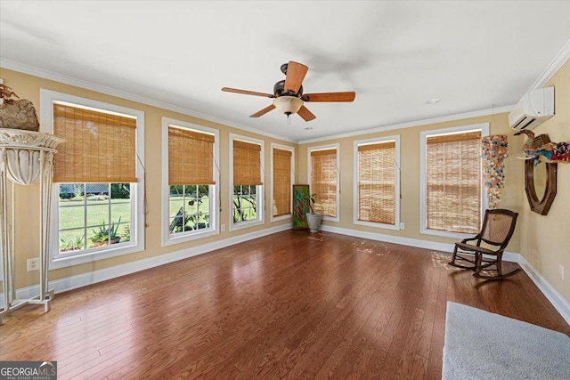 unfurnished room featuring wood finished floors, crown molding, and an AC wall unit