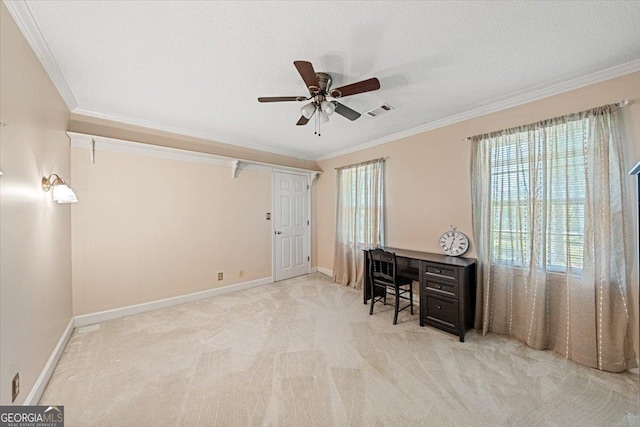 office space with carpet, visible vents, crown molding, and a ceiling fan