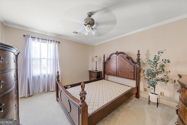 bedroom featuring crown molding, light colored carpet, visible vents, baseboards, and a ceiling fan