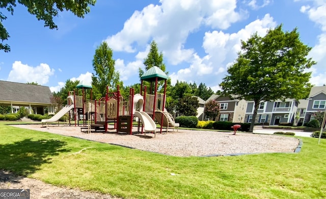 view of jungle gym with a lawn