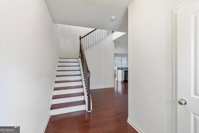 stairs with hardwood / wood-style flooring