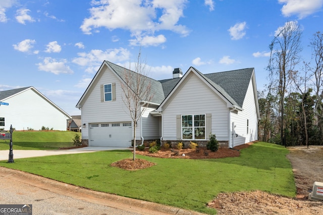 view of front facade featuring a front yard and a garage