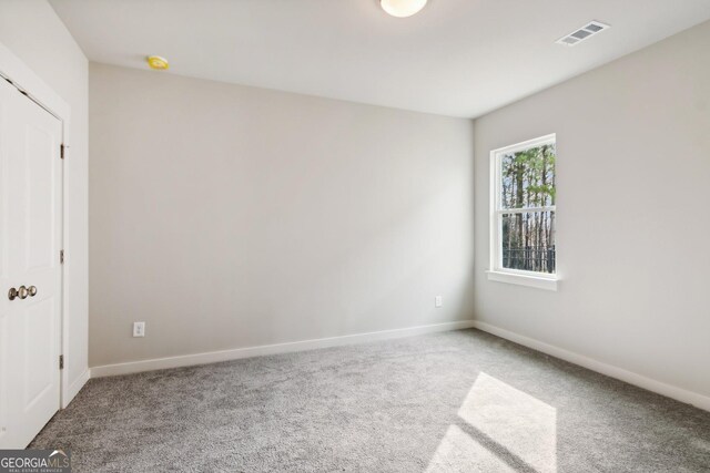 unfurnished room with carpet floors