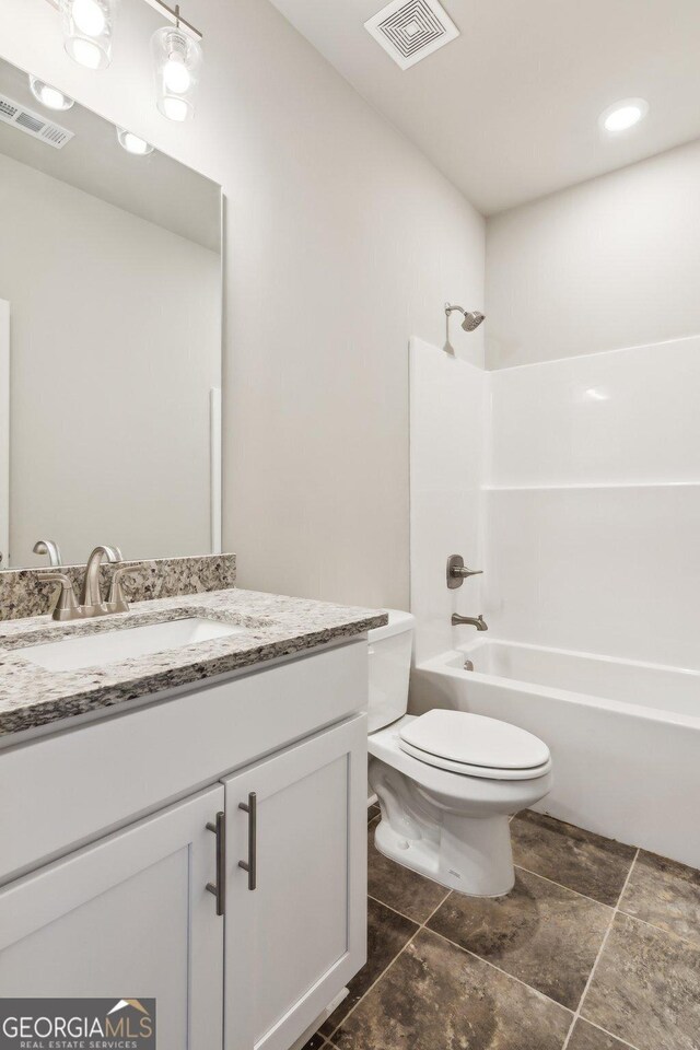 full bathroom with vanity, shower / bathing tub combination, and toilet