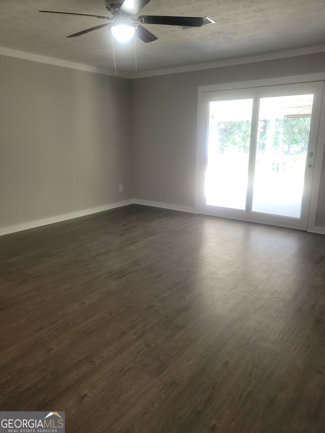 spare room with ceiling fan, wood-type flooring, and ornamental molding