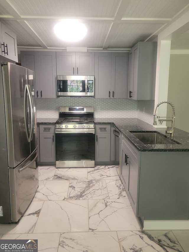 kitchen featuring sink, light tile patterned flooring, gray cabinets, and stainless steel appliances