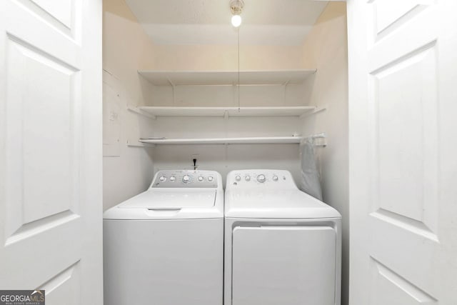 laundry area with independent washer and dryer