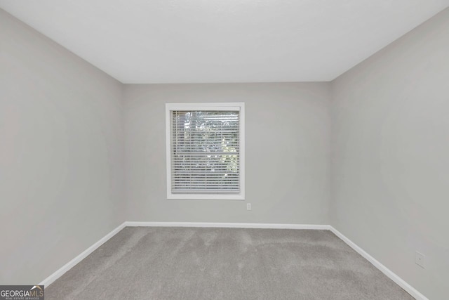 empty room featuring carpet flooring