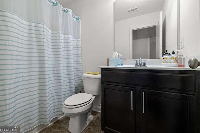 bathroom featuring visible vents, vanity, and toilet