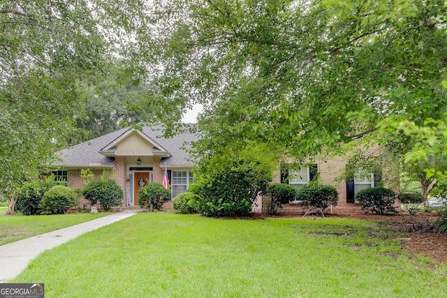 ranch-style house with a front lawn