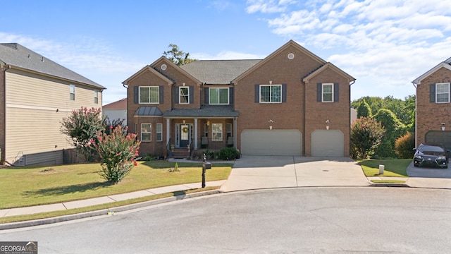 view of front of house featuring a front lawn and a garage