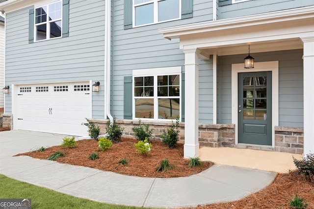 view of exterior entry featuring a garage