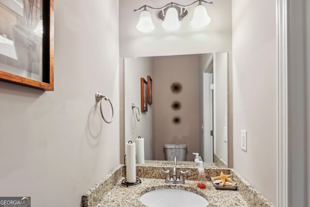 bathroom with vanity and toilet