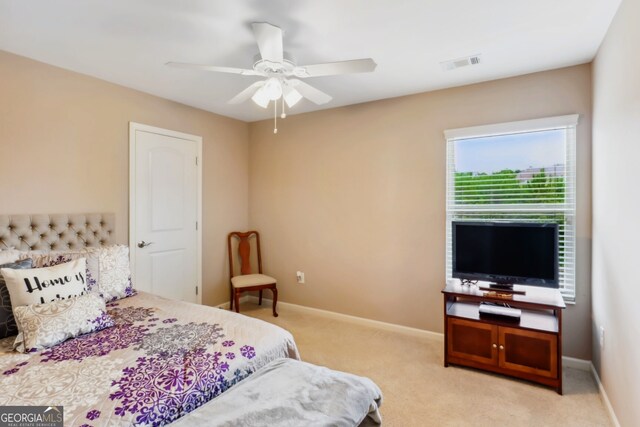 carpeted bedroom with ceiling fan