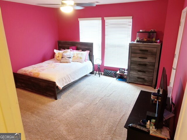 carpeted bedroom featuring ceiling fan