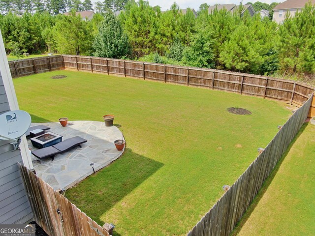 view of yard with a patio area