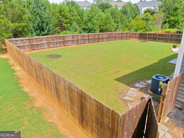 view of yard with central AC