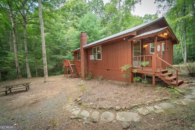 view of side of home featuring cooling unit