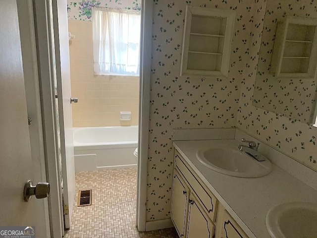 bathroom with tile patterned floors and vanity