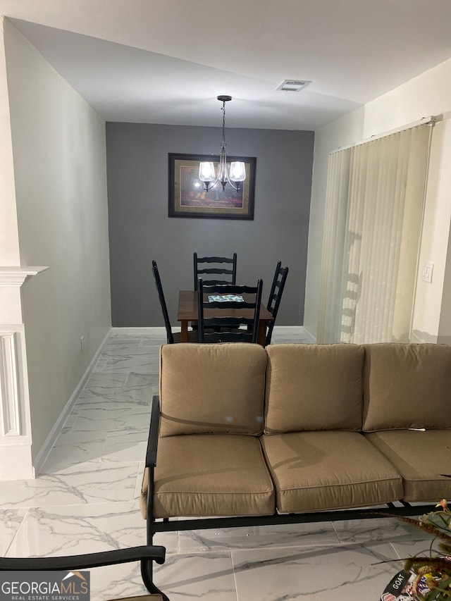 living room with a notable chandelier