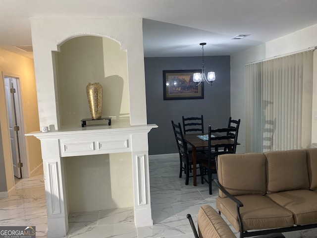 dining room with a notable chandelier