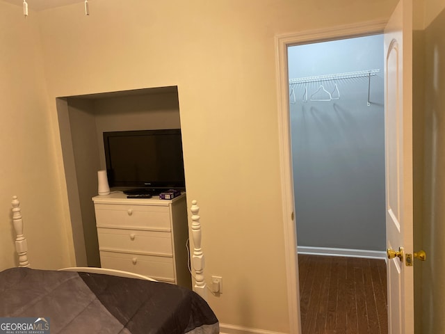 bedroom featuring dark hardwood / wood-style floors