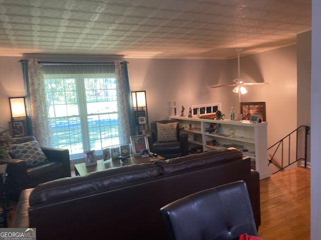 living room featuring hardwood / wood-style flooring and ceiling fan