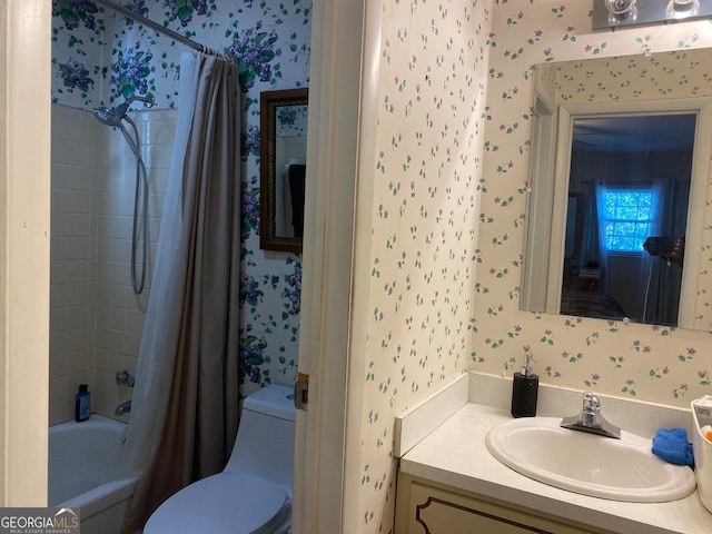 full bathroom with shower / bath combo, vanity, and toilet