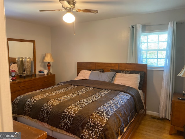 bedroom featuring ceiling fan and light hardwood / wood-style flooring