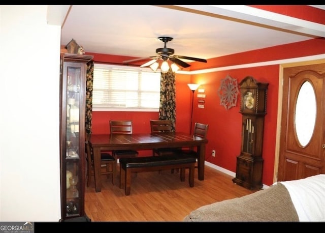 dining area featuring ceiling fan and wood-type flooring