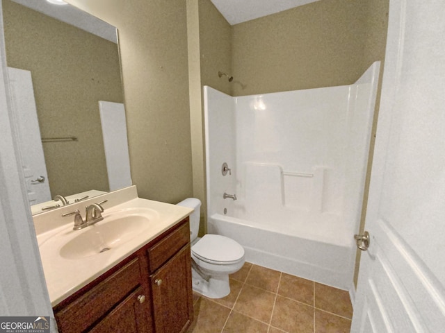 bathroom with vanity, bathtub / shower combination, tile patterned flooring, and toilet