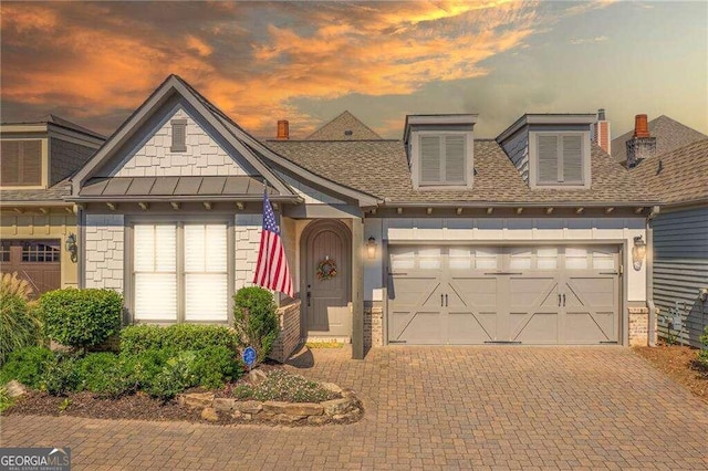 view of front of property featuring a garage