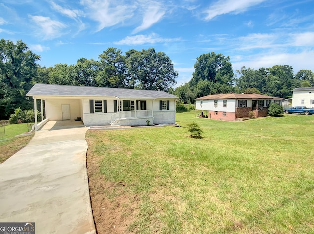 ranch-style home with a carport, a porch, a front lawn, and concrete driveway